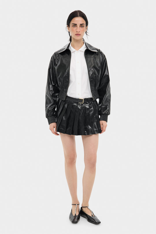 TRIXIE PLEATED LEATHER MINI SKIRT IN VOID BLACK