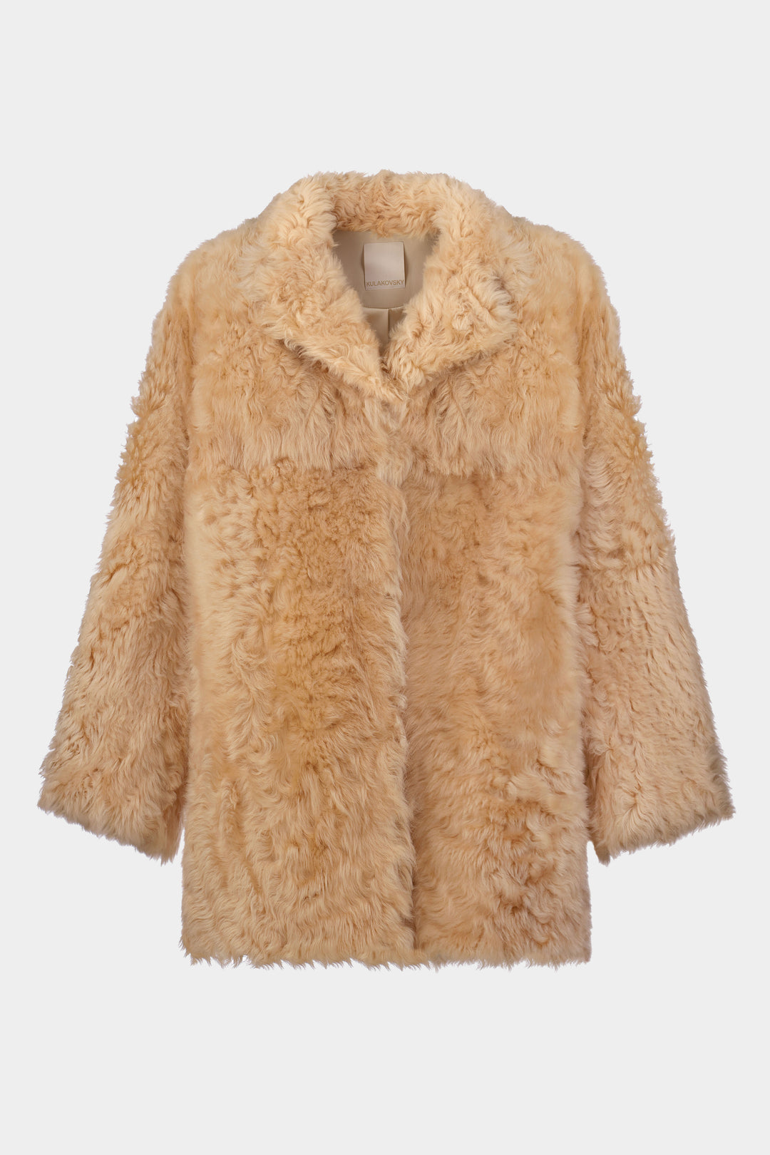 ELONGATED SHEARLING COAT IN BEIGE