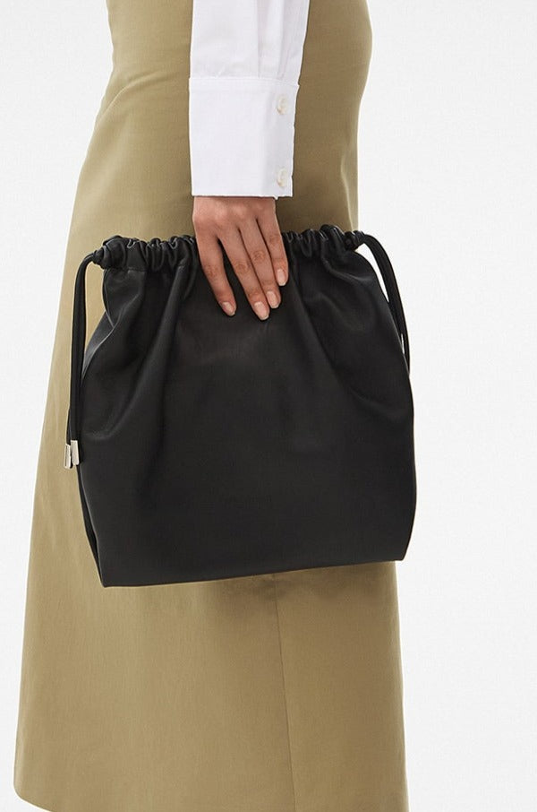 EMMY LEATHER POUCH BAG IN BLACK