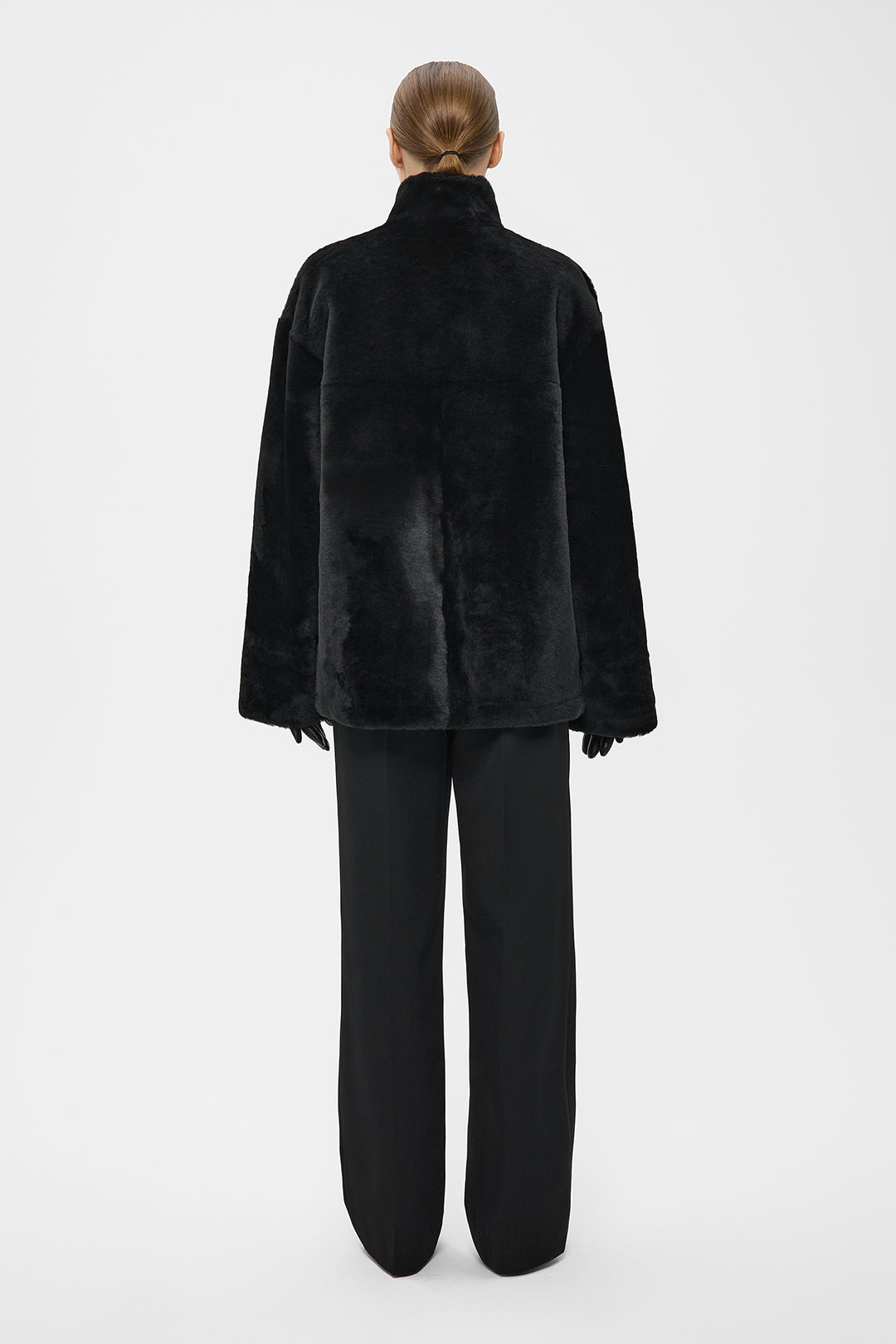 SILKY ELONGATED SHEARLING BOMBER JACKET IN BLACK