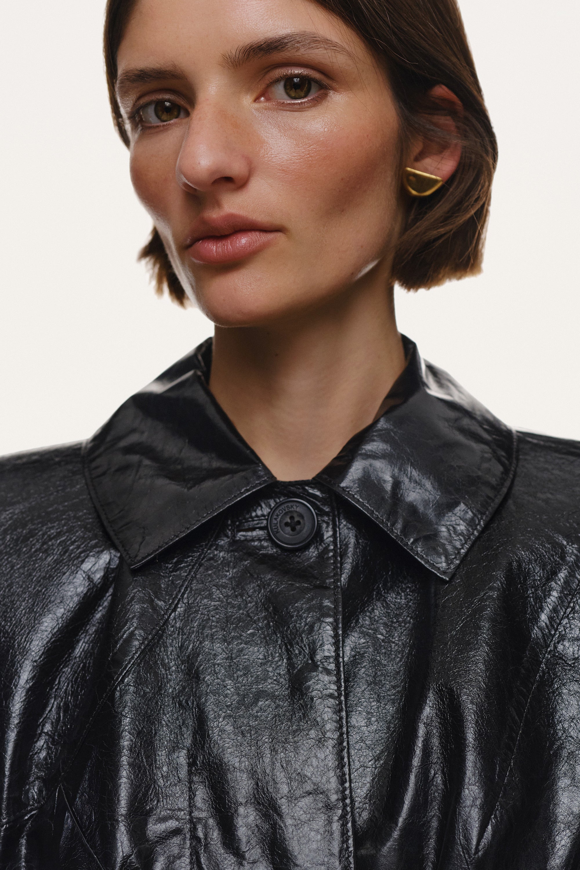 DETERMINATION LAMINATED LEATHER COAT IN BLACK KULAKOVSKY